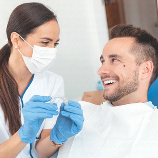 dentist and patient discussing cost of Invisalign in Mission Viejo