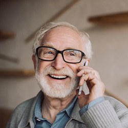 Man talking on the phone while at home
