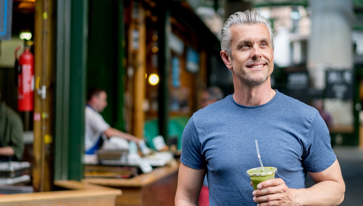 Man sharing healthy smile after dental implant tooth replacement