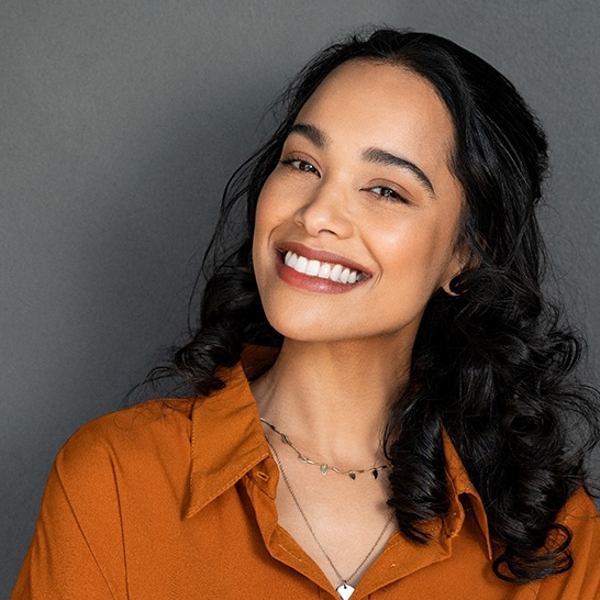 Smiling woman enjoying the benefits of gum contouring