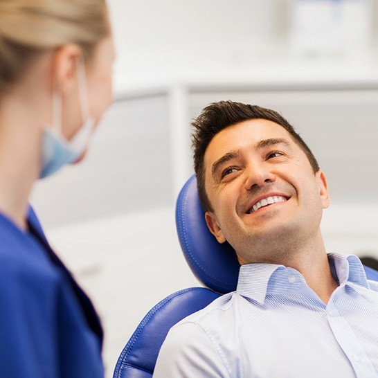 Smiling woman enjoying the benefits of gum contouring