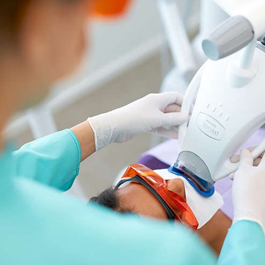 Patient receiving zoom teeth whitening treatment