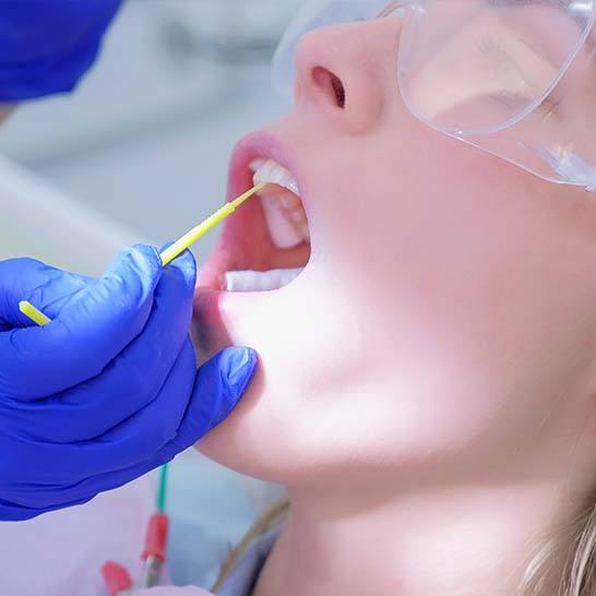 Patient receiving fluoride treatment