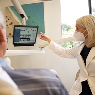 Mission Viejo dentist and patient looking at chairside computer screen