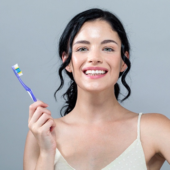 Woman with beautiful smile after teeth whitening in Mission Veijo