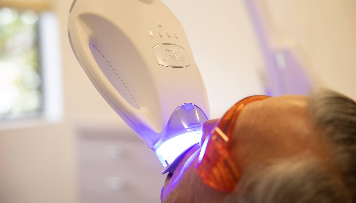 Patient receiving Zoom teeth whitening treatment