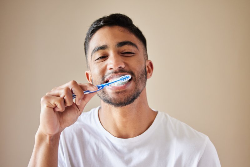 portrait of someone brushing their teeth