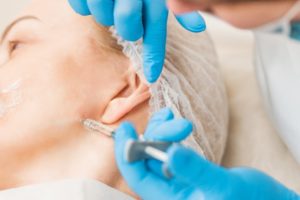 woman receiving Botox for TMJ relief 